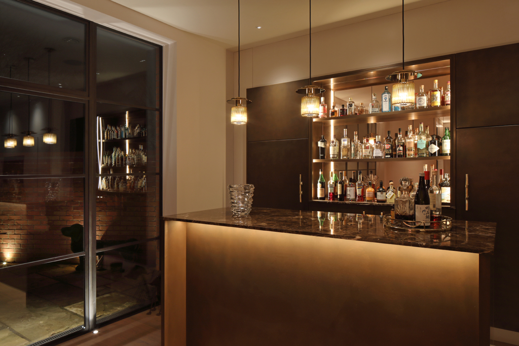 Strip lighting in bar and uplighting to windows