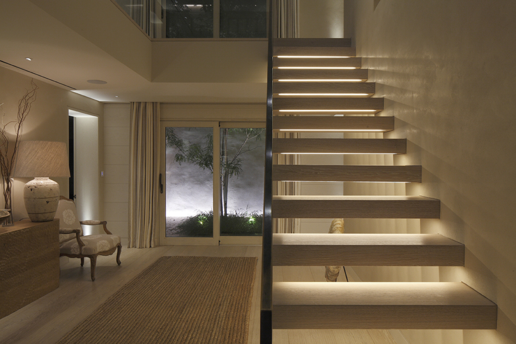 integrated linear lighting into contemporary staircase