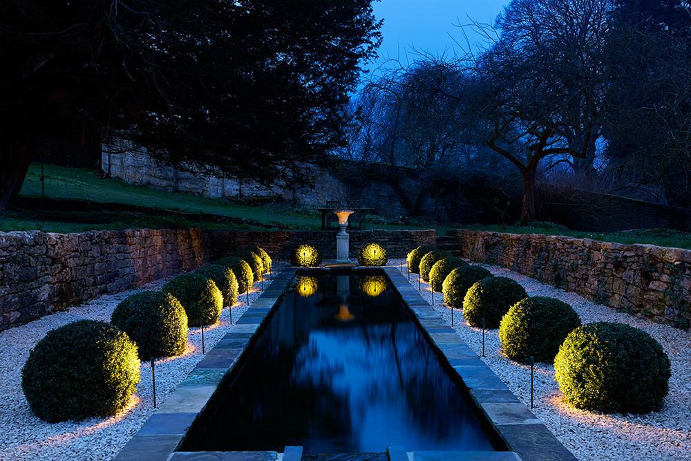 box balls up lit surrounding water rill