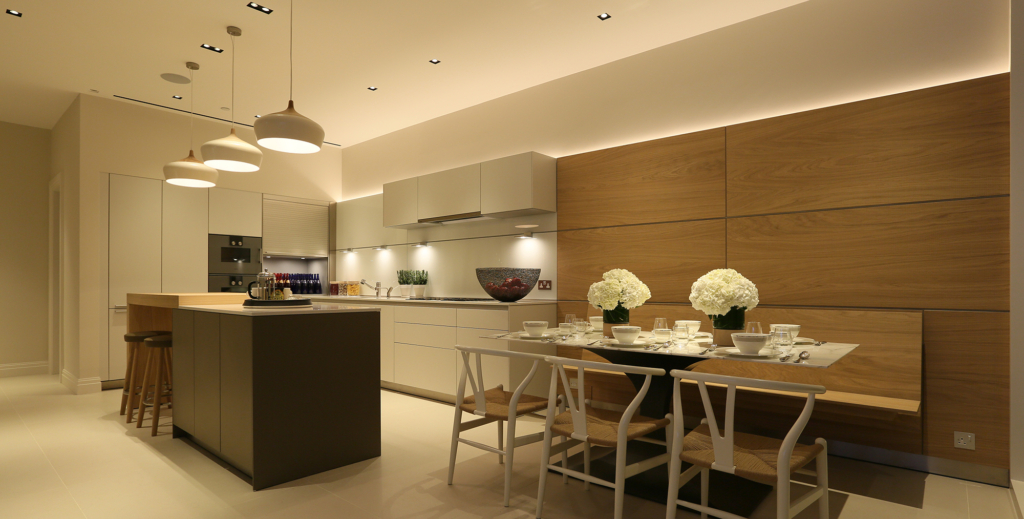 contemporary kitchen with pendants, island and banquette