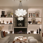 back lit shelving in living room with grand central pendant