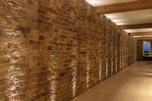 Light different textures and surfaces to highlight them including bare brick, for an industrial look