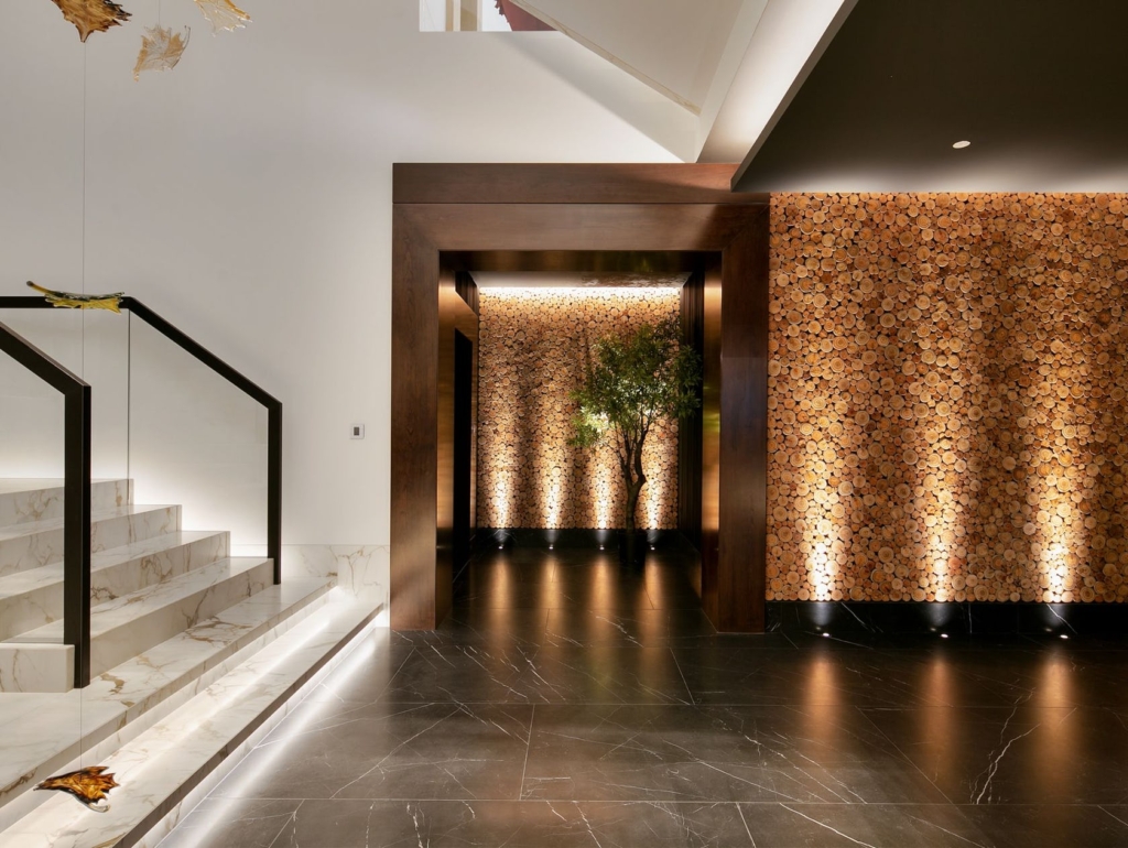 Hallway with uplights and stair lighting detail