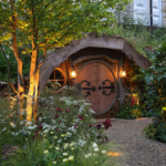 Blue Forest hobbit house at chelsea flower show with lighting