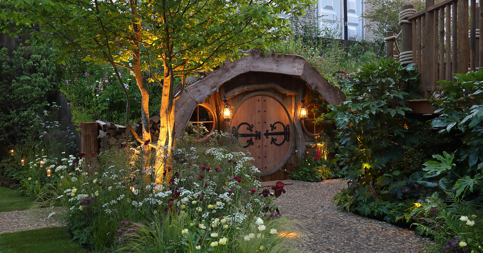 Blue Forest hobbit house at chelsea flower show with lighting