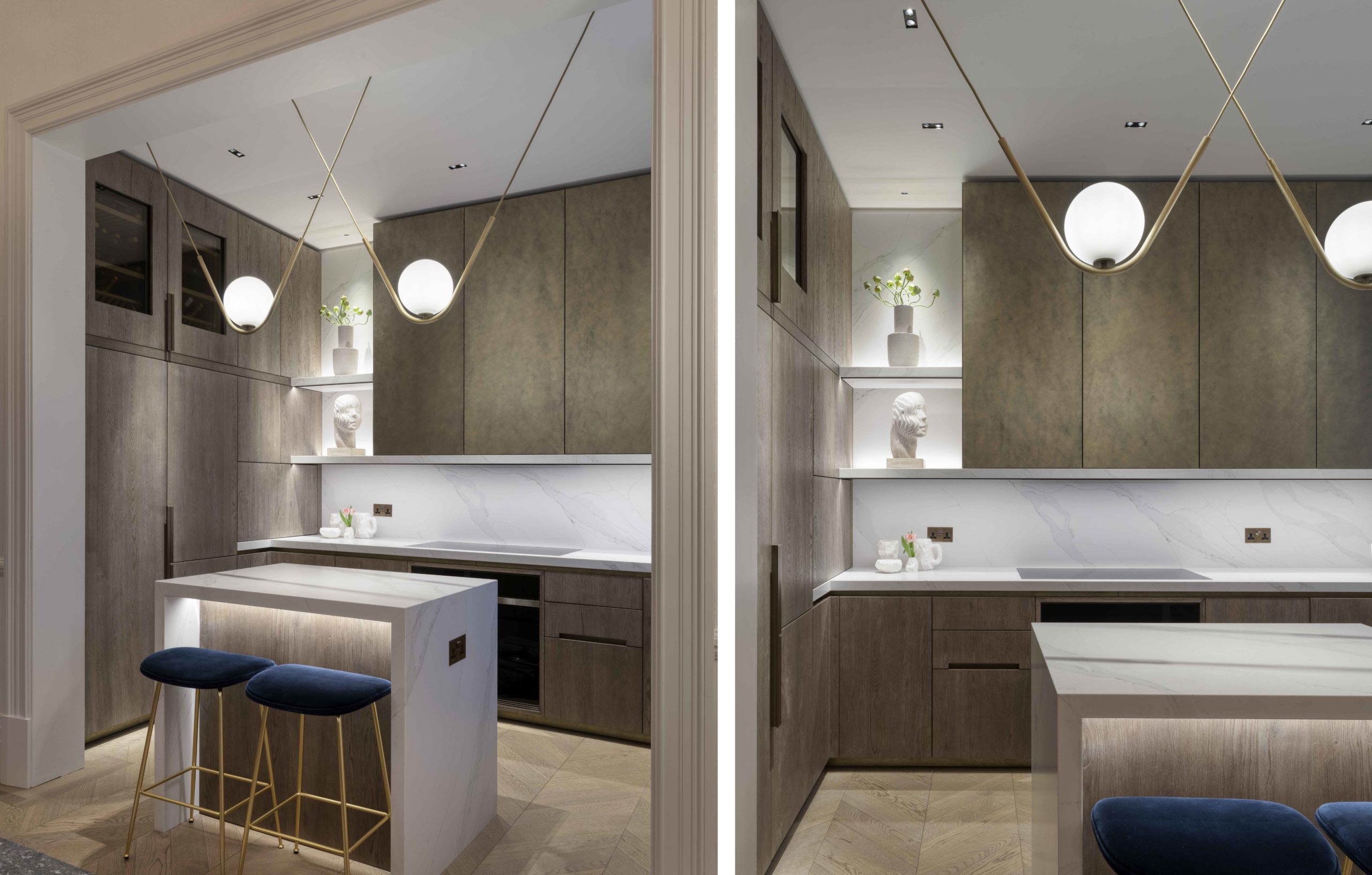 interesting kitchen with hanging white ball pendants and discreet architectural lighting with island