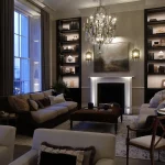 heritage living room with shelf lighting and uplights to the fireplace