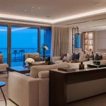 view across luxury living area to stunning lighting