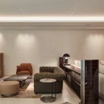 Living room area with coffer lighting and light to art