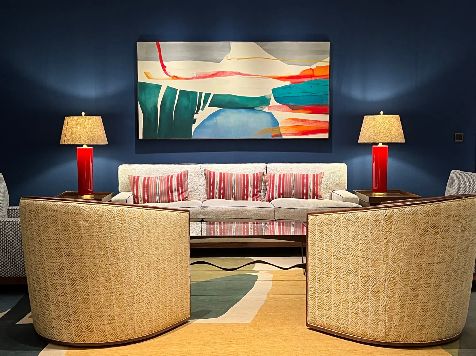 bold blue wall with colourful furniture and lighting