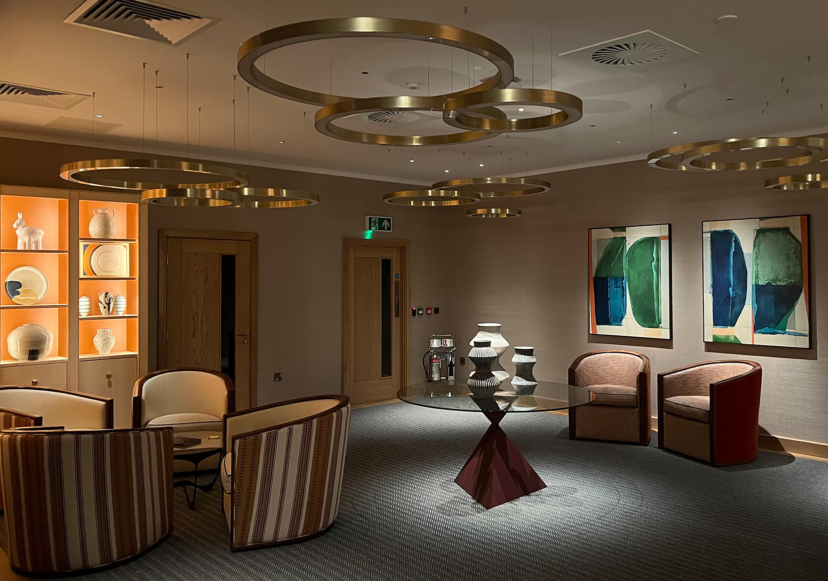 office reception with decorative pendants and moody lighting