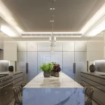 layered kitchen lighting in marble kitchen