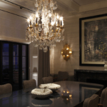 traditional dining room with large chandelier and uplit shutter box