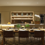 Dining area beside kitchen with calming lighting