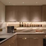 sleek contemporary kitchen with creative concealed lighting