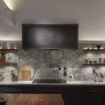 task and shelf lighting in this marble and wood kitchen elevation