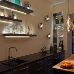 wall mounted shelves backlit with linear light in modern kitchen