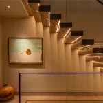 Staircase lit with linear strip under each tread