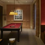 bar area and pool table in entertainment room