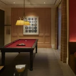 bar area and pool table in entertainment room