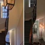 Two views of elegant staircase with uplight to windows and view own hallway to lit object