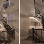 spiral staircase down centre of house with linear light under curve of stairs