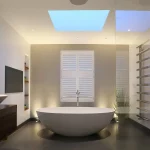 contemporary bathroom with back lit freestanding bath with skylight above