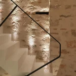 uplit textured wall on staircase