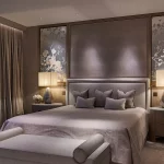 luxury bedroom with strip light to curtains and downlights to bedhead and art
