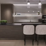 sleek contemporary kitchen with three seats at bar