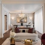 presidential suite living room at mina a'salam hotel dubai with chandelier and lit shelving