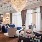 royal suite at mina a'salam hotel dubai with chandelier and lit shelving