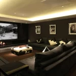 Large cinema room with coffer ceiling and downlight to coffee table
