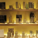 Beauty products on backlit shelving
