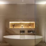 freestanding bath with lit slot detail above