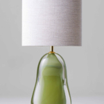 Table lamp with green glass base and white shade