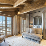 Cosy bedroom in chalet with view out onto mountains