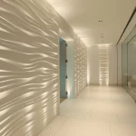 corridor in spa with uplighting to wavy textured wall