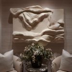 sculpted artwork lit with soft wash from downlights