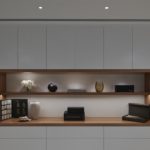 JOinery shelves lit with linear lighting and downlights to front of wall