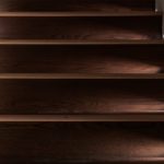 wooden stair treads lit with miniature Lucca 30 steplights washing across