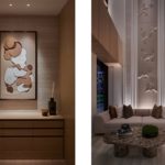 Artwork lit with downlights, and a wall wash uplight highlighting floor to ceiling mural