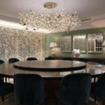 Elegant dining room lighting with uplighting to mural wallpaper