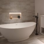 sleek contemporary bathroom with uplight behind the bath