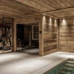 basement swimming pool and gym with light emphasising the timber