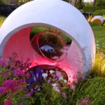 concrete sculpture structure with pink lighting inside